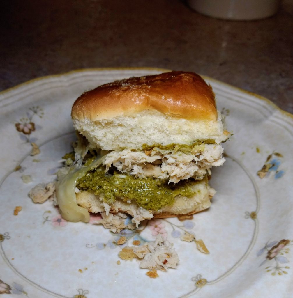 shredded chicken italian sliders with pesto on a plate